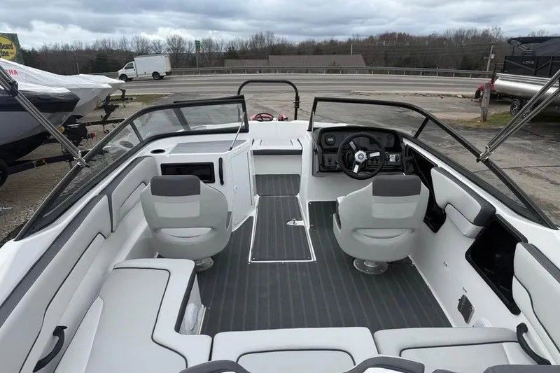 Slide: The Image of 2026 Yamaha Boats SX190 interior with modern seating and steering console. - 6