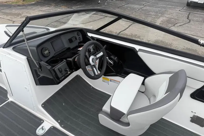 Slide: The Image of 2026 Yamaha Boats SX190 interior with steering wheel and dashboard controls. - 7
