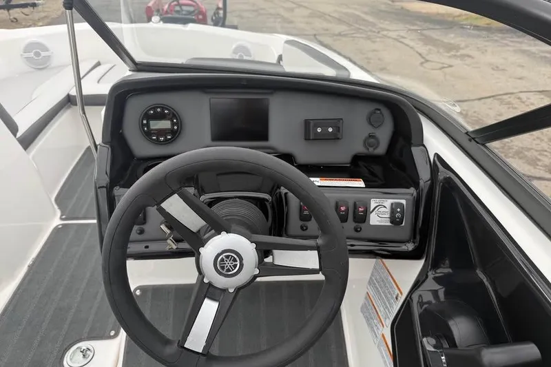 Slide: The Image of Steering console of 2026 Yamaha Boats SX190, featuring modern controls and dashboard. - 8