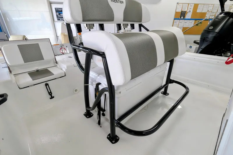 Slide: The Image of 2026 Frontier 2104 boat interior with cushioned seating and storage. - 10
