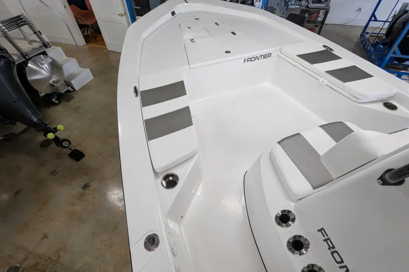 Slide: The Image of 2026 Frontier 2104 boat interior with seating and storage compartments. - 11