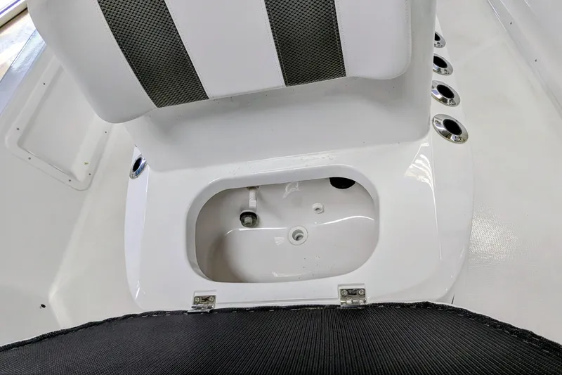 Slide: The Image of Frontier 2104 boat seat with storage compartment, 2026 model, featuring rod holders. - 12