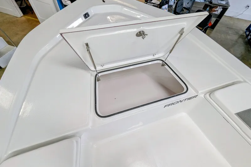 Slide: The Image of 2026 Frontier 2104 boat storage compartment open, showcasing spacious interior design. - 14