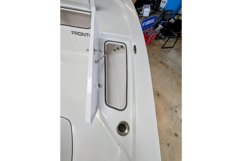 Slide: The Image of 2026 Frontier 2104 boat with open storage compartment on deck. - 15