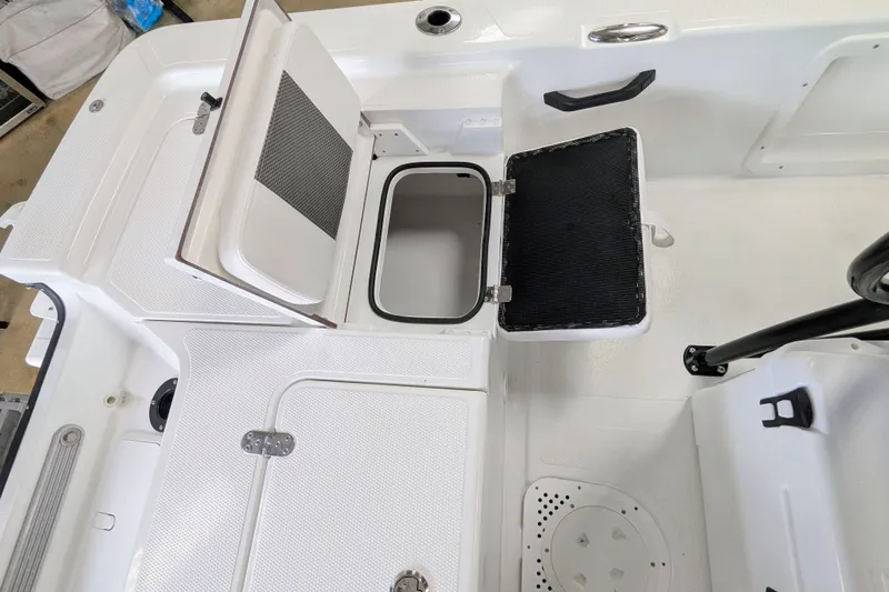 Slide: The Image of Open storage compartments on a 2026 Frontier 2104 boat deck. - 20