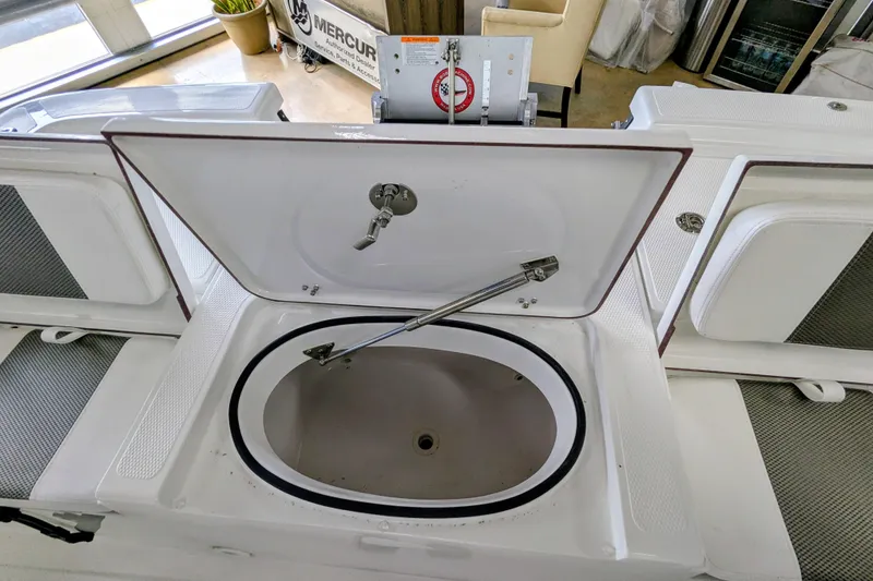 Slide: The Image of Open storage compartment on a 2026 Frontier 2104 boat, showcasing interior details. - 22