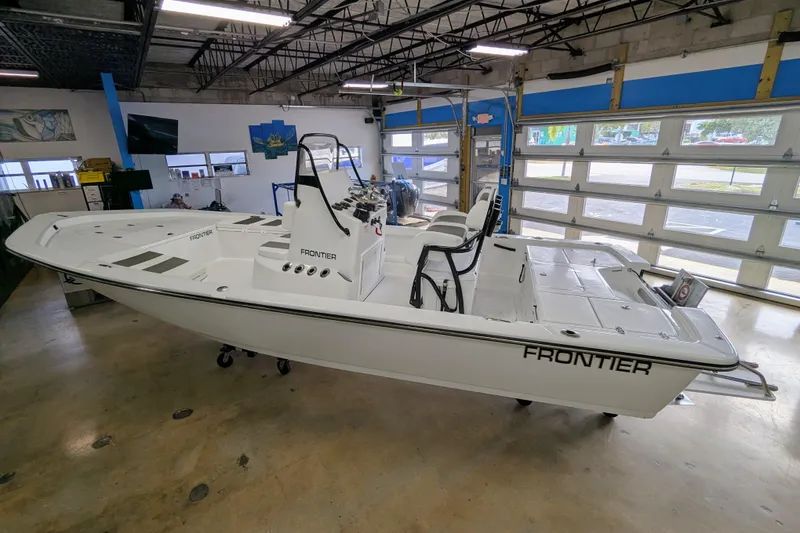 Slide: The Image of 2026 Frontier 2104 boat in showroom, featuring sleek design and modern amenities. - 3