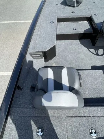 Slide: The Image of 2023 Vexus AVX181 boat interior with gray seating and carpeted deck. - 7
