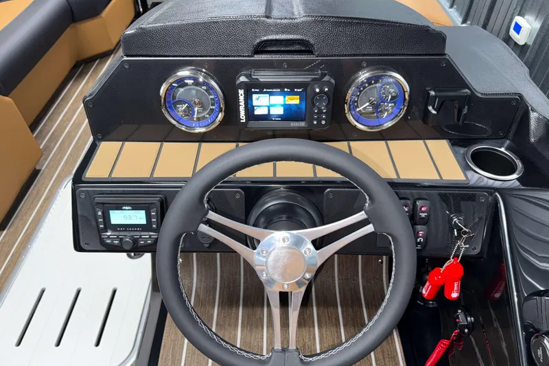 Slide: The Image of 2026 Premier 230 SunSation RF Tritoon dashboard with steering wheel and modern controls. - 12