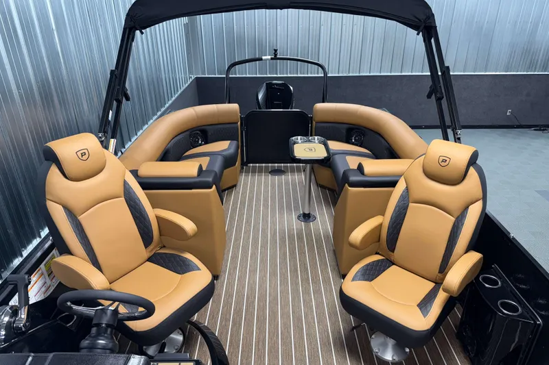 Slide: The Image of Luxurious interior of 2026 Premier 230 SunSation RF Tritoon with tan leather seating. - 17