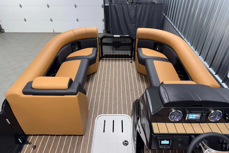 Slide: The Image of Luxurious interior of 2026 Premier 230 SunSation RF Tritoon with tan and black seating. - 18