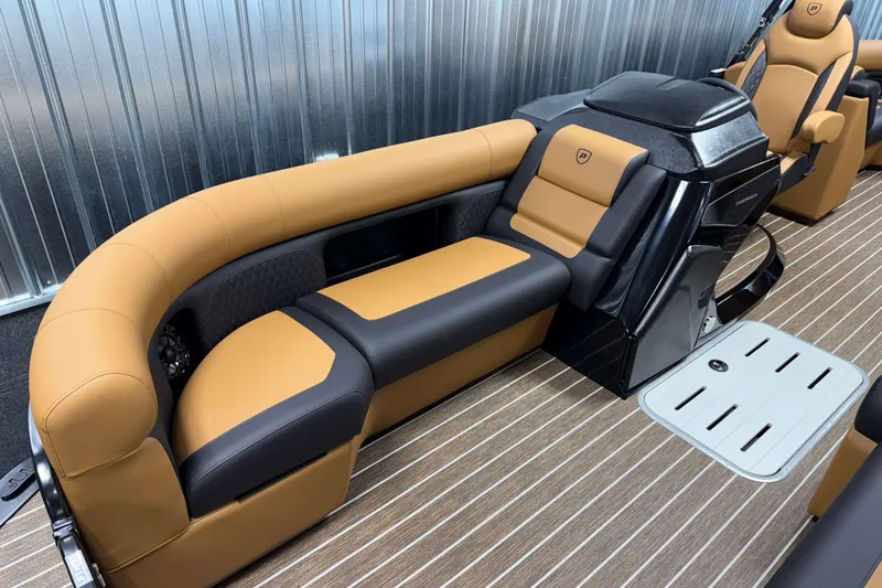 Slide: The Image of Luxurious interior of 2026 Premier 230 SunSation RF Tritoon with tan and black seating. - 20