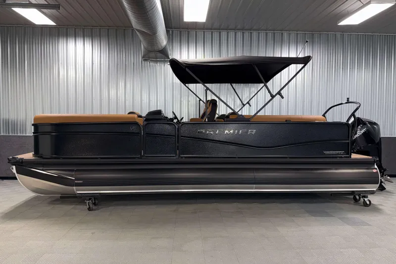 Slide: The Image of 2026 Premier 230 SunSation RF Tritoon in showroom, featuring sleek design and modern amenities. - 3