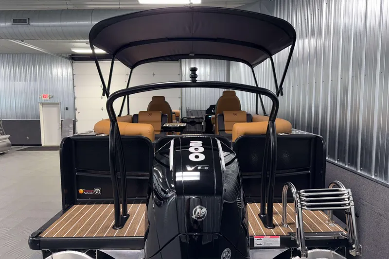 Slide: The Image of 2026 Premier 230 SunSation RF Tritoon with 200 V6 engine in a showroom. - 6