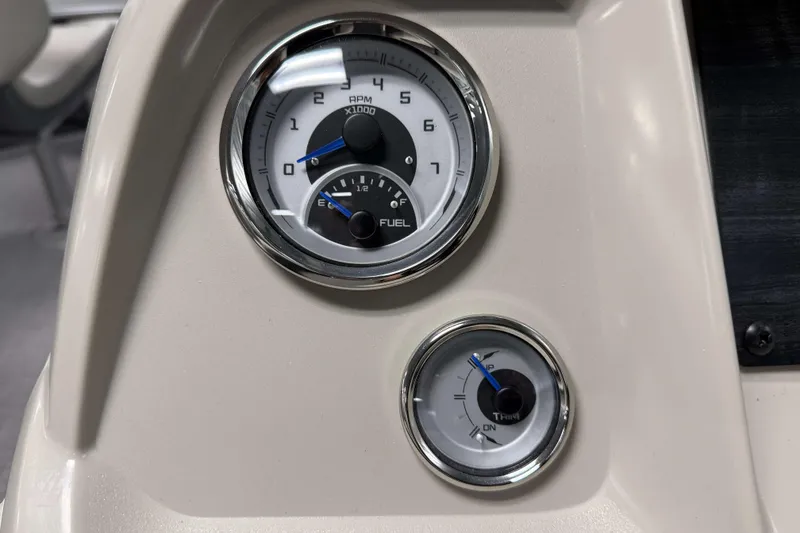 Slide: The Image of Dashboard gauges of 2026 SunChaser Vista 18 Fish boat, showing RPM and fuel levels. - 11