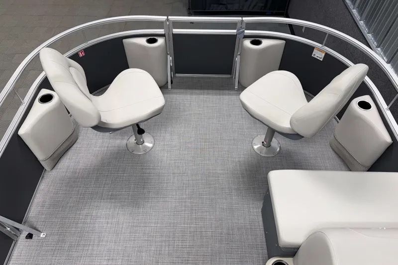 Slide: The Image of 2026 SunChaser Vista 18 Fish boat interior with swivel seats and cup holders. - 15