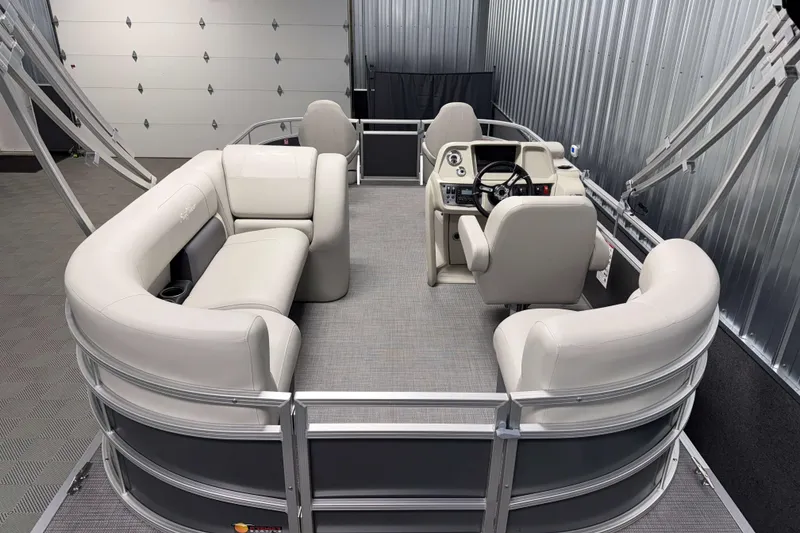 Slide: The Image of 2026 SunChaser Vista 18 Fish pontoon boat interior with plush seating and modern helm. - 2