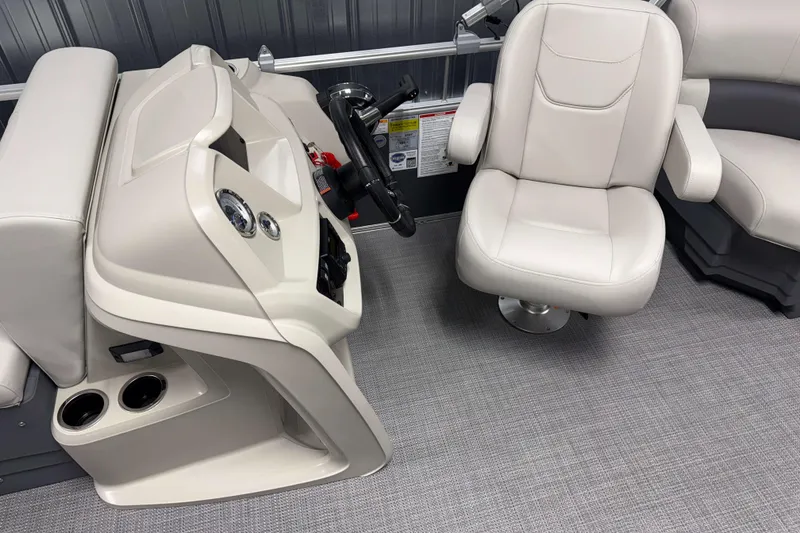 Slide: The Image of 2026 SunChaser Vista 18 Fish boat interior with helm and swivel chair. - 6