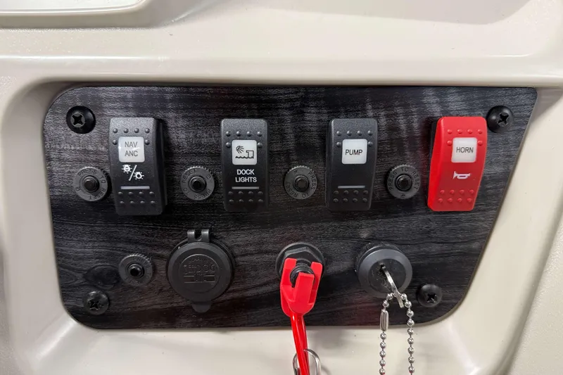 Slide: The Image of Control panel of 2026 SunChaser Vista 18 Fish boat with switches and ignition. - 9