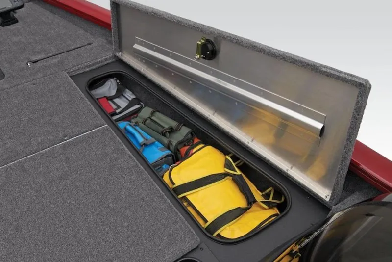 Slide: The Image of 2025 Tracker Pro Team 175 boat storage compartment with organized gear bags. - 6