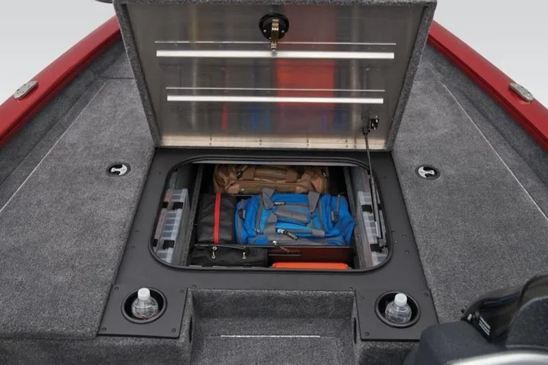 Slide: The Image of 2025 Tracker Pro Team 175 boat storage compartment with organized gear and accessories. - 9