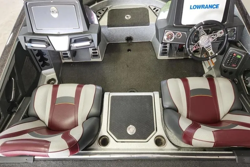 Slide: The Image of 2018 Ranger Z521L boat interior with dual seats, steering wheel, and Lowrance electronics. - 4