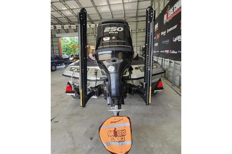 Slide: The Image of 2018 Ranger Z521L boat with 250 Pro motor in a garage setting. - 5