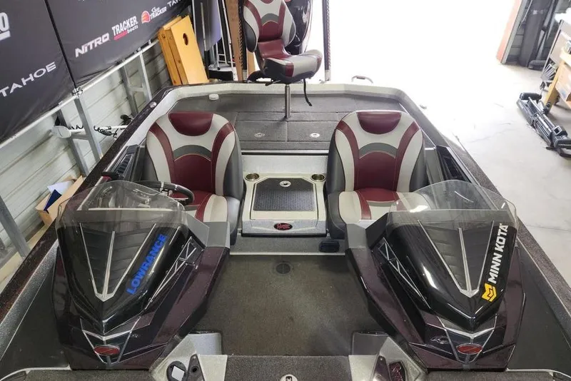 Slide: The Image of 2018 Ranger Z521L boat interior with dual seats and advanced navigation systems. - 6
