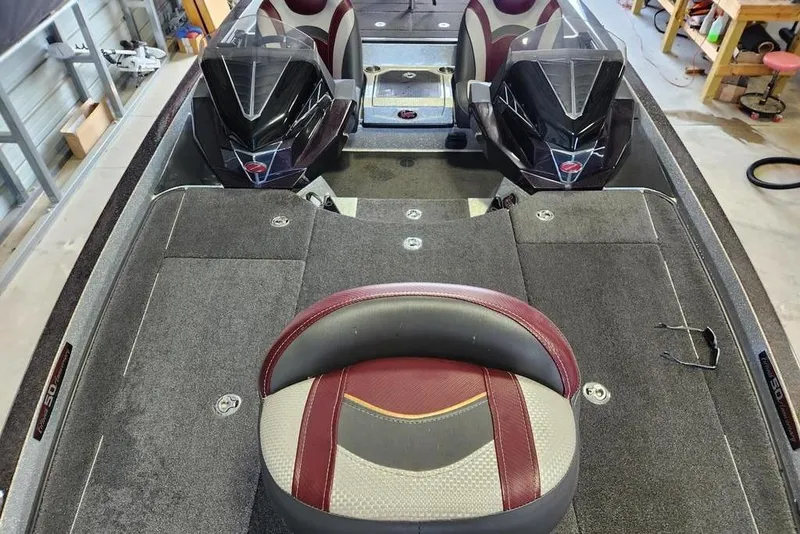Slide: The Image of 2018 Ranger Z521L boat interior with dual seats and carpeted deck. - 8