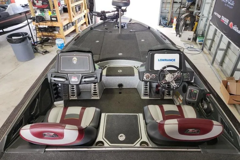 Slide: The Image of 2018 Ranger Z521L boat interior with dual seats, steering wheel, and Lowrance display. - 9