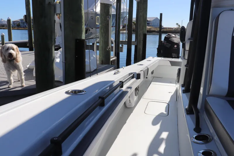 Slide: The Image of 2021 Costa Custom Boats 26 with Mercury Pro XS engine docked at marina. - 13