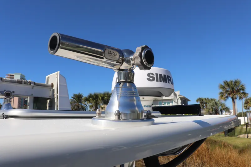 Slide: The Image of 2021 Costa Custom Boats 26 with TACO marine hardware and Simrad radar, under clear blue sky. - 15