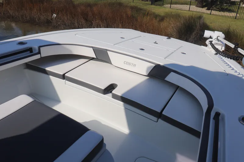 Slide: The Image of 2021 Costa Custom Boats 26 interior seating area with sleek design and modern features. - 2