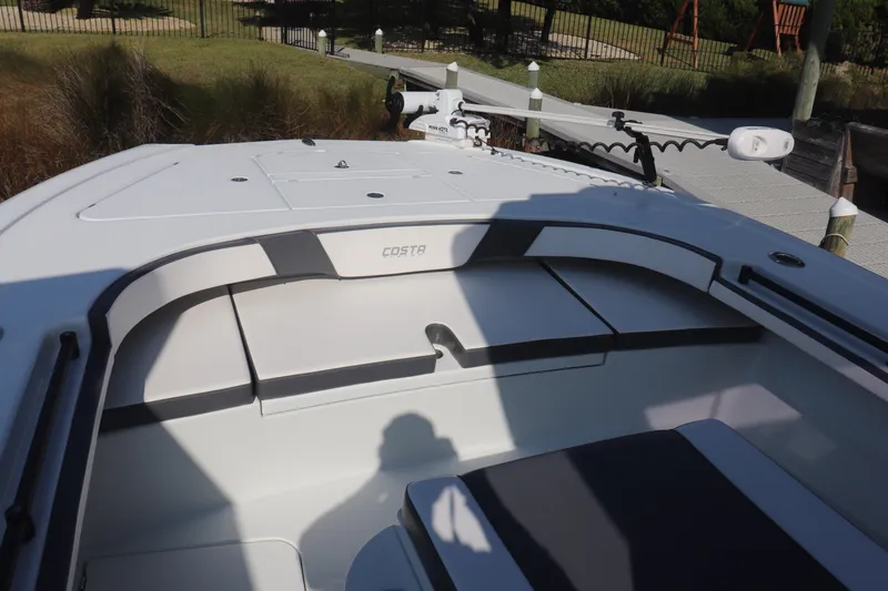 Slide: The Image of 2021 Costa Custom Boats 26 model, featuring sleek seating and modern design. - 5