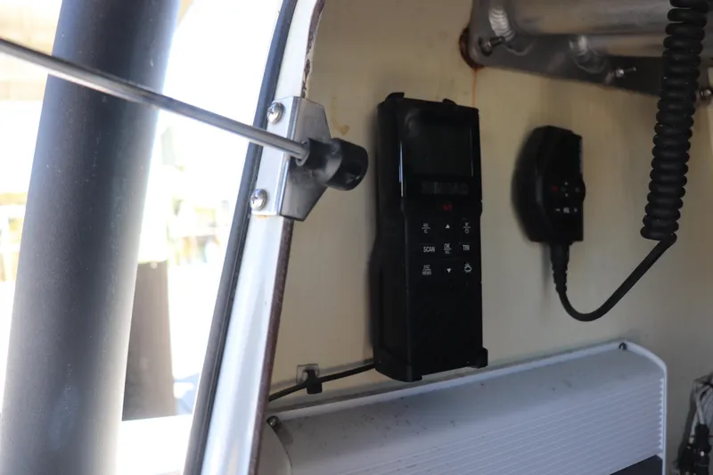 Slide: The Image of Interior of 2021 Costa Custom Boats 26, featuring advanced electronic equipment and wiring. - 9