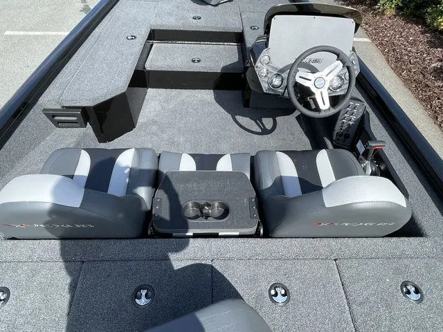 Slide: The Image of 2023 Vexus AVX181 boat interior with steering console and seating arrangement. - 5