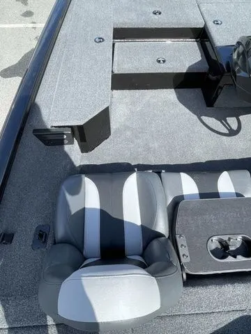 Slide: The Image of 2023 Vexus AVX181 boat interior with gray seating and storage compartments. - 7