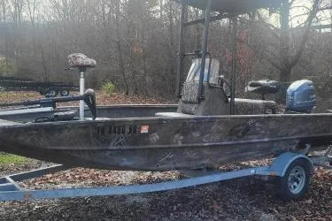 The Image of 2020 G3 Gator Tough 17 CC boat on trailer in wooded area. - 0