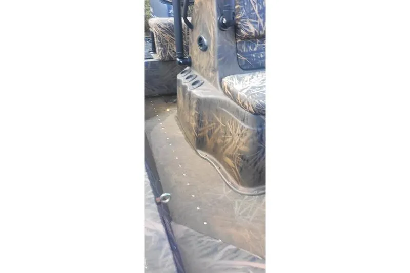 Slide: The Image of Interior of 2020 G3 Gator Tough 17 CC boat with camo seating and flooring. - 4