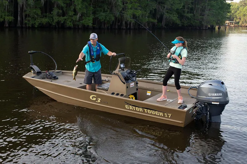 Slide: The Image of Manufacturer Provided Image: 2020 G3 Gator Tough 17 CC boat on a lake with two people fishing. - 7