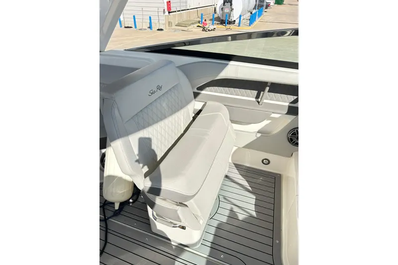 Slide: The Image of 2020 Sea Ray SLX 310 boat interior with white seating and sleek design. - 10