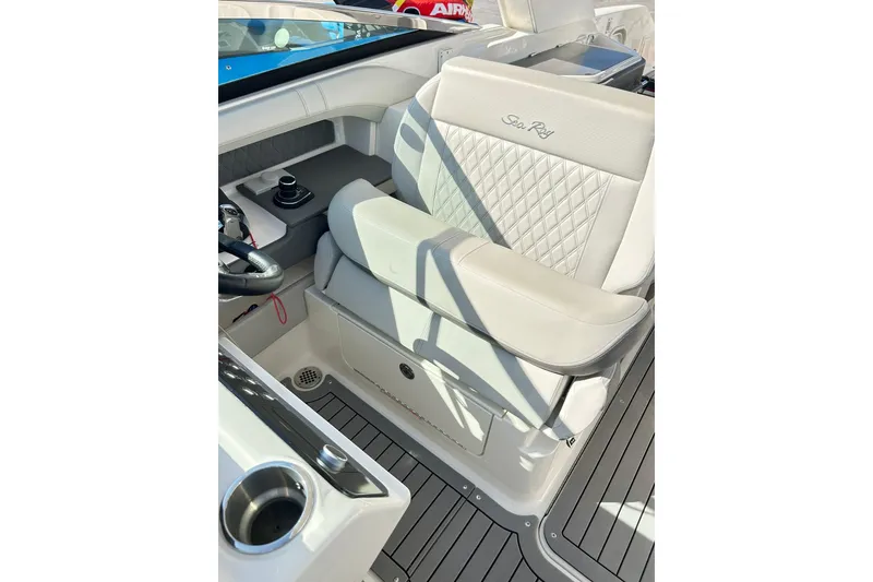 Slide: The Image of Luxurious 2020 Sea Ray SLX 310 boat interior with plush seating and modern controls. - 11