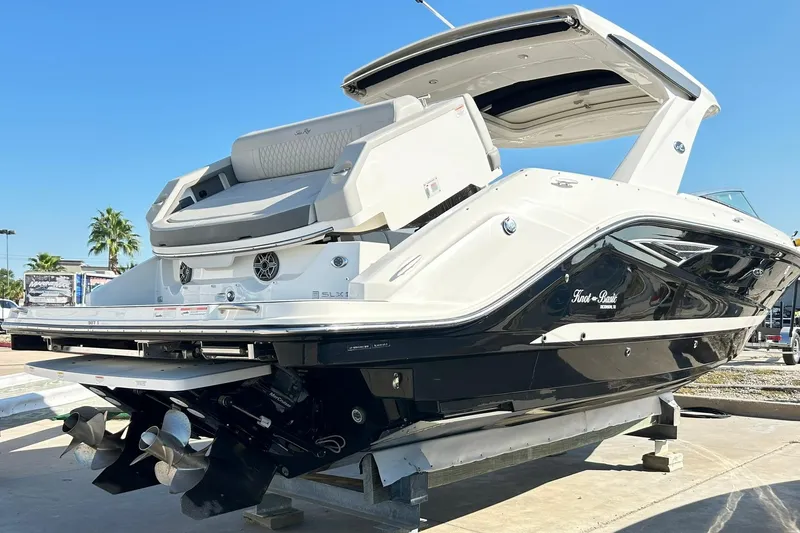 Slide: The Image of 2020 Sea Ray SLX 310 boat on display, featuring sleek design and modern amenities. - 13