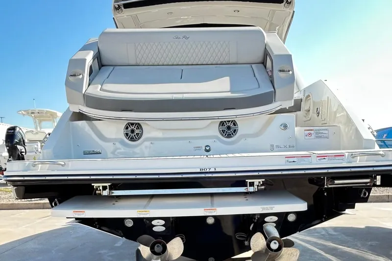 Slide: The Image of 2020 Sea Ray SLX 310 boat rear view with seating and propellers. - 15