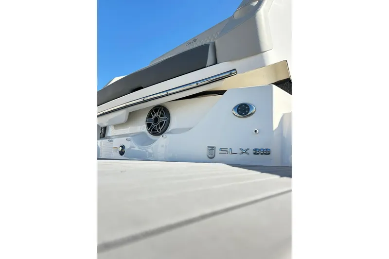 Slide: The Image of 2020 Sea Ray SLX 310 boat rear view with speaker and logo details. - 17