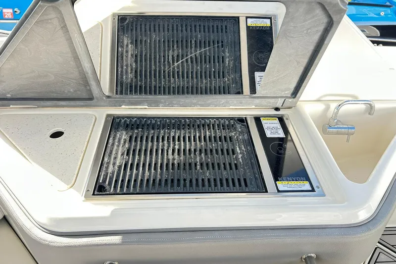 Slide: The Image of Outdoor grill and sink on 2020 Sea Ray SLX 310 boat deck. - 19