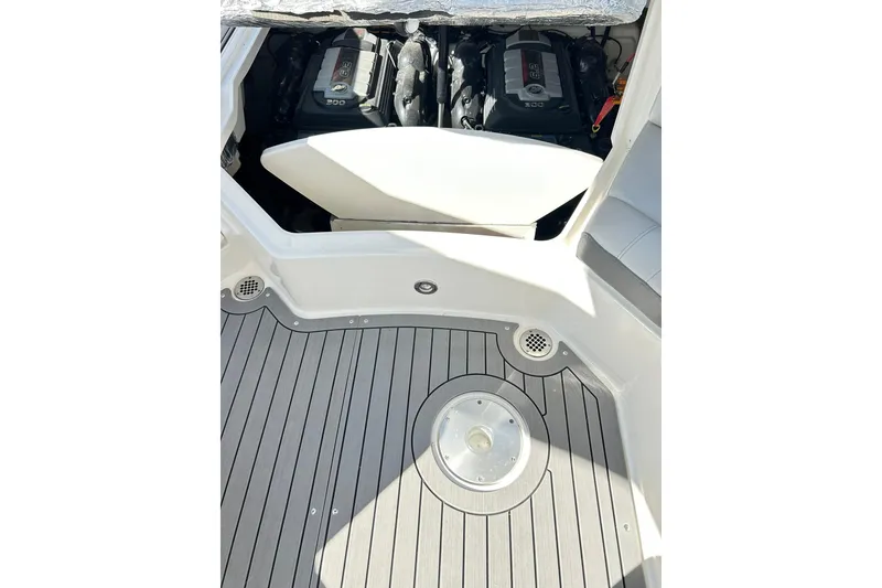 Slide: The Image of 2020 Sea Ray SLX 310 boat engine compartment with sleek deck design. - 28