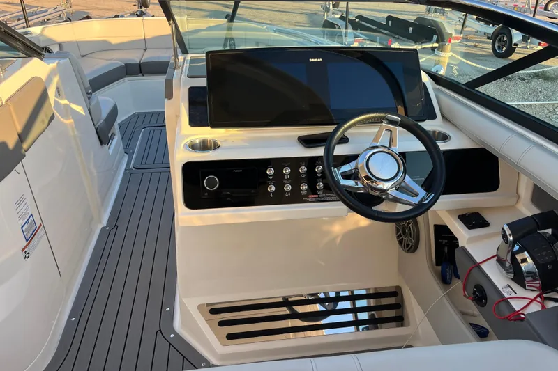 Slide: The Image of 2020 Sea Ray SLX 310 boat cockpit with steering wheel and control panel. - 3