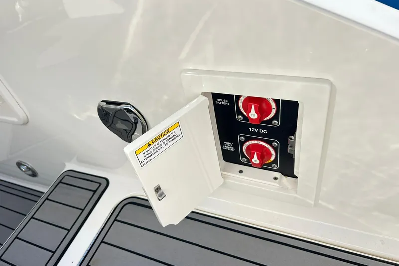 Slide: The Image of Battery switch panel on 2020 Sea Ray SLX 310 boat deck. - 31