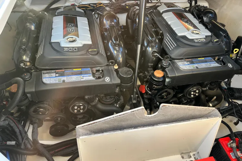 Slide: The Image of Twin Mercury engines in a 2020 Sea Ray SLX 310 boat. - 34